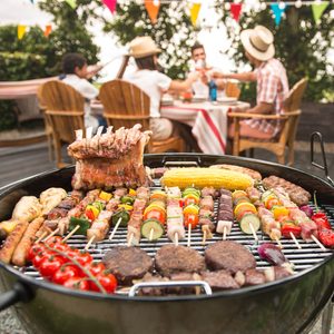 Family having a barbecue party in their garden in summer