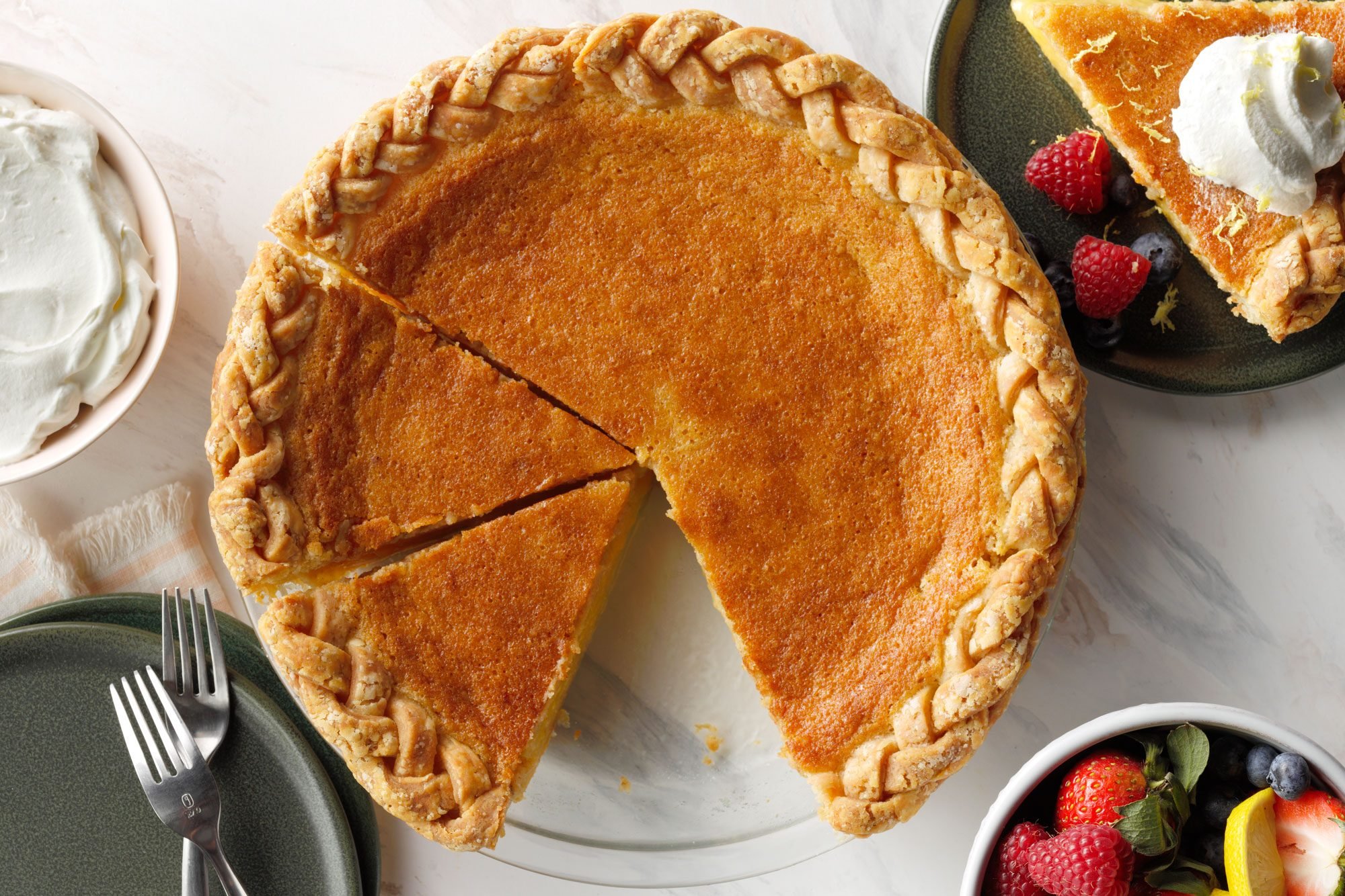 Sliced Buttermilk pie in serving plate