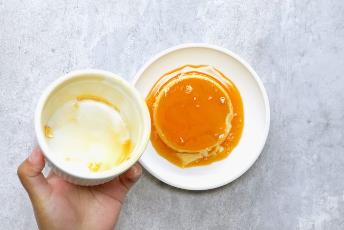 Place a small plate upside down on top of the cup and flip them