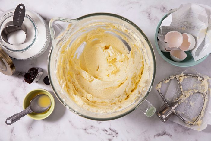Cream, butter, sugar and eggs mixed in a bowl