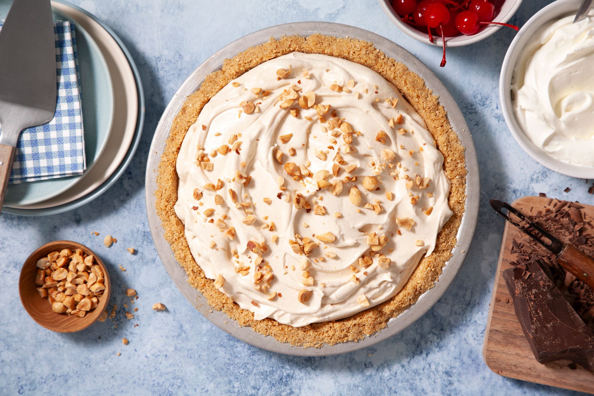 Peanut Butter Pie served in a plate with peanut and whipped cream topping