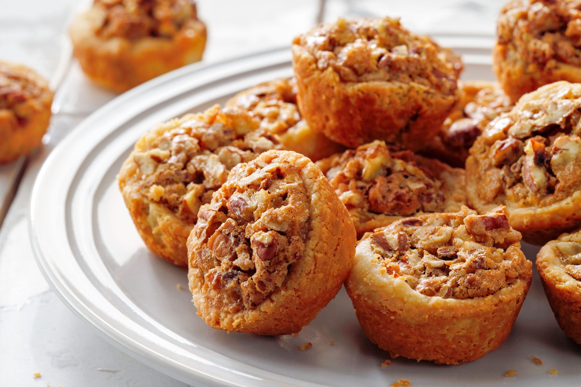 Pecan Tassies on a White Ceramic Plate