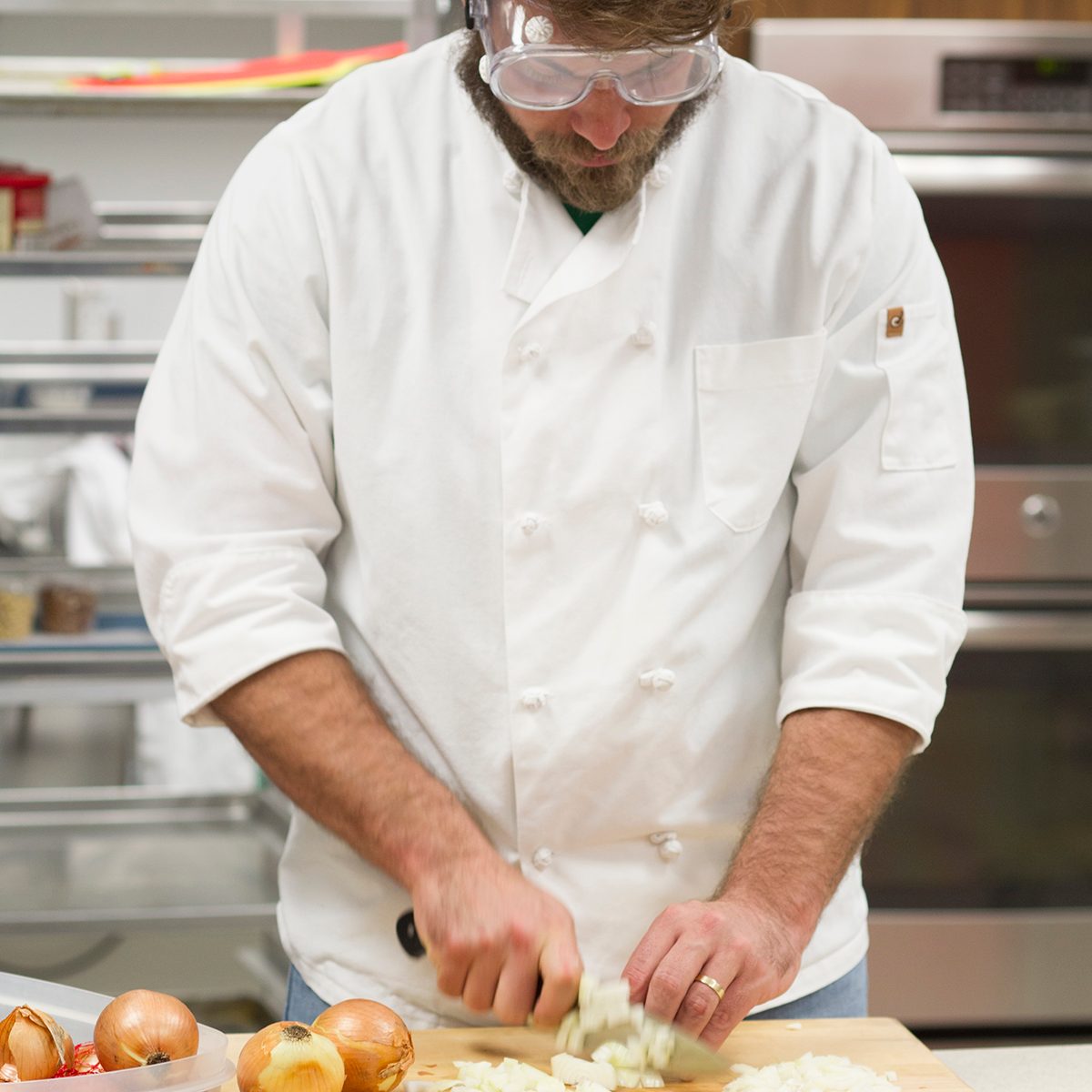 Chef cutting onions