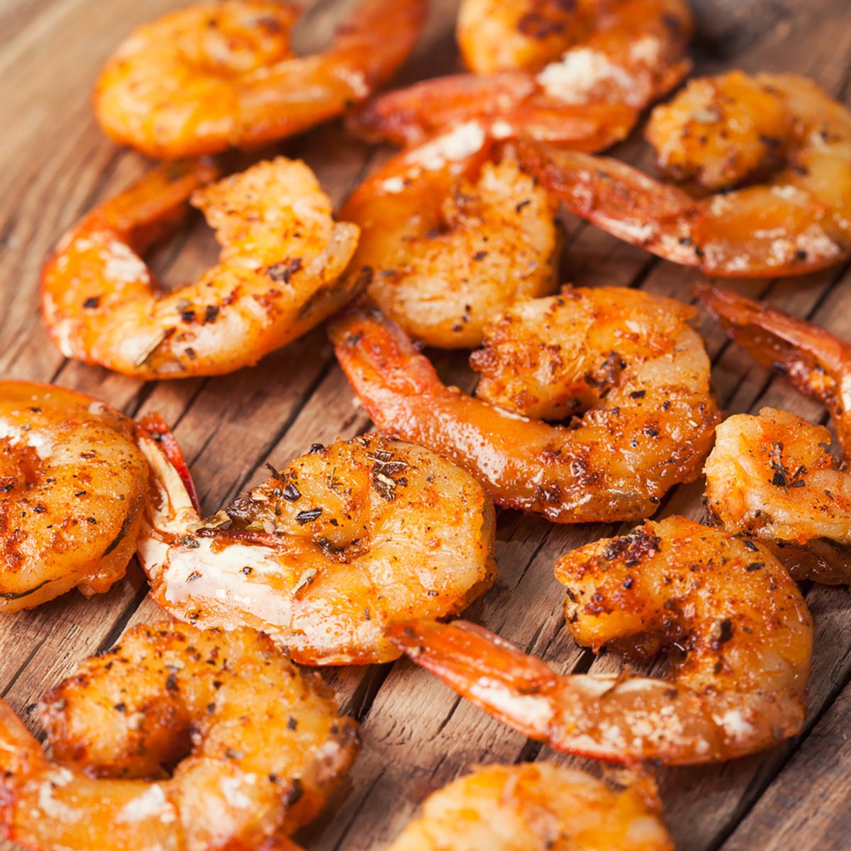Shrimps fried on a wooden background