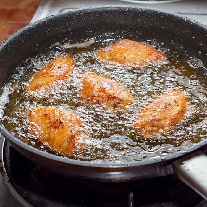 Chicken frying in a pan