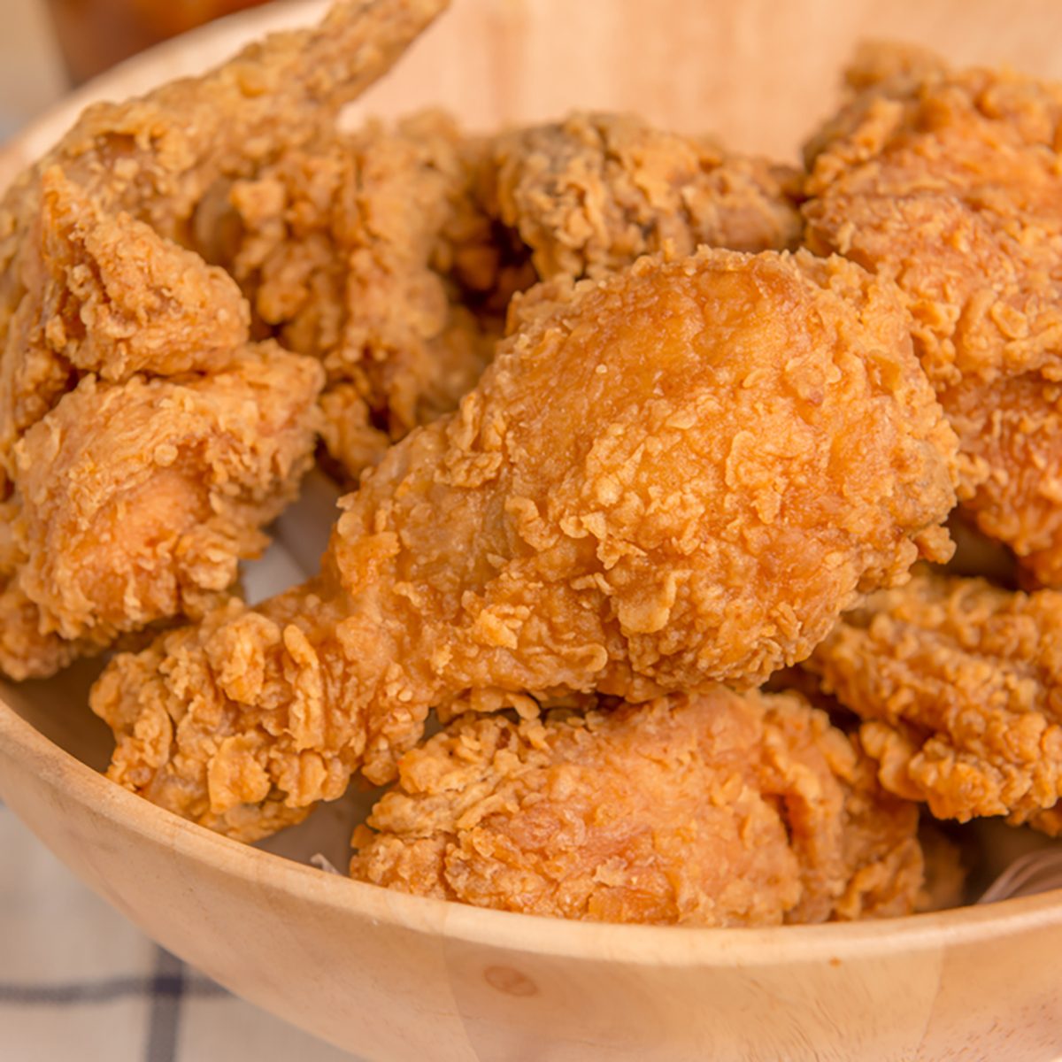 crispy fried chicken on wood plate
