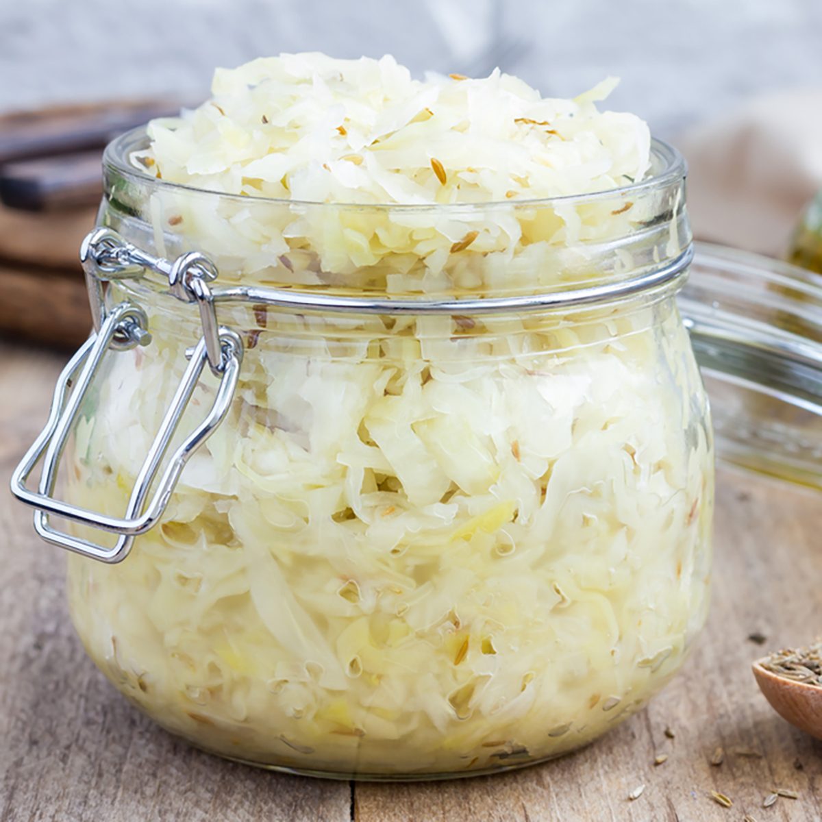 Homemade sauerkraut with cumin in a glass jar 
