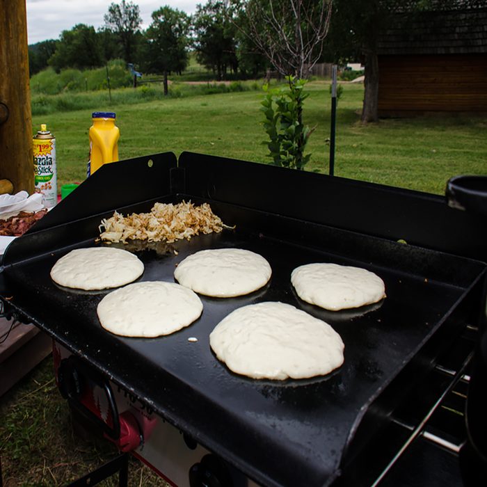 Pancakes and hashbrooms good on a camp griddle stove at a campground in rural Wyoming in the summer.