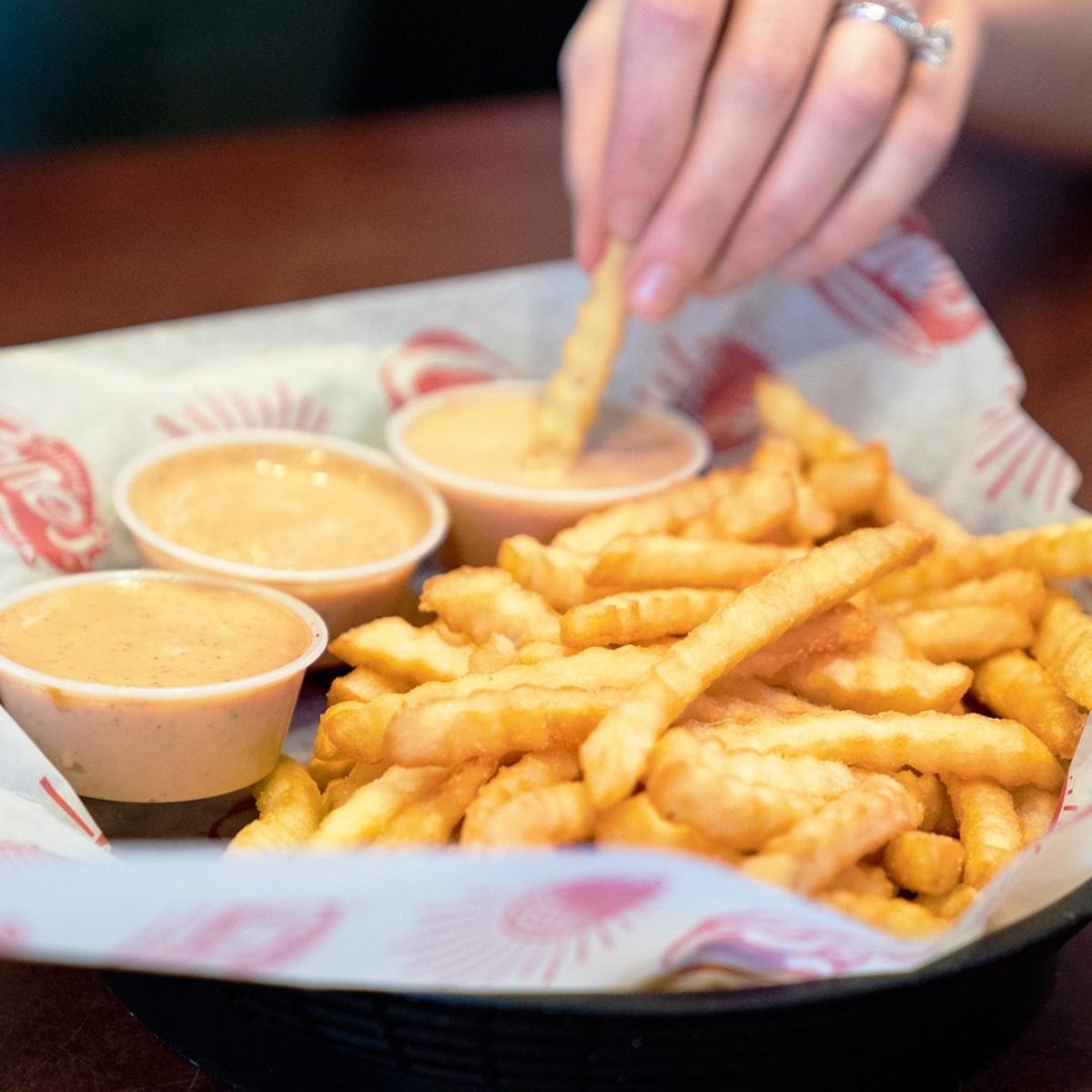 Person eating french fries