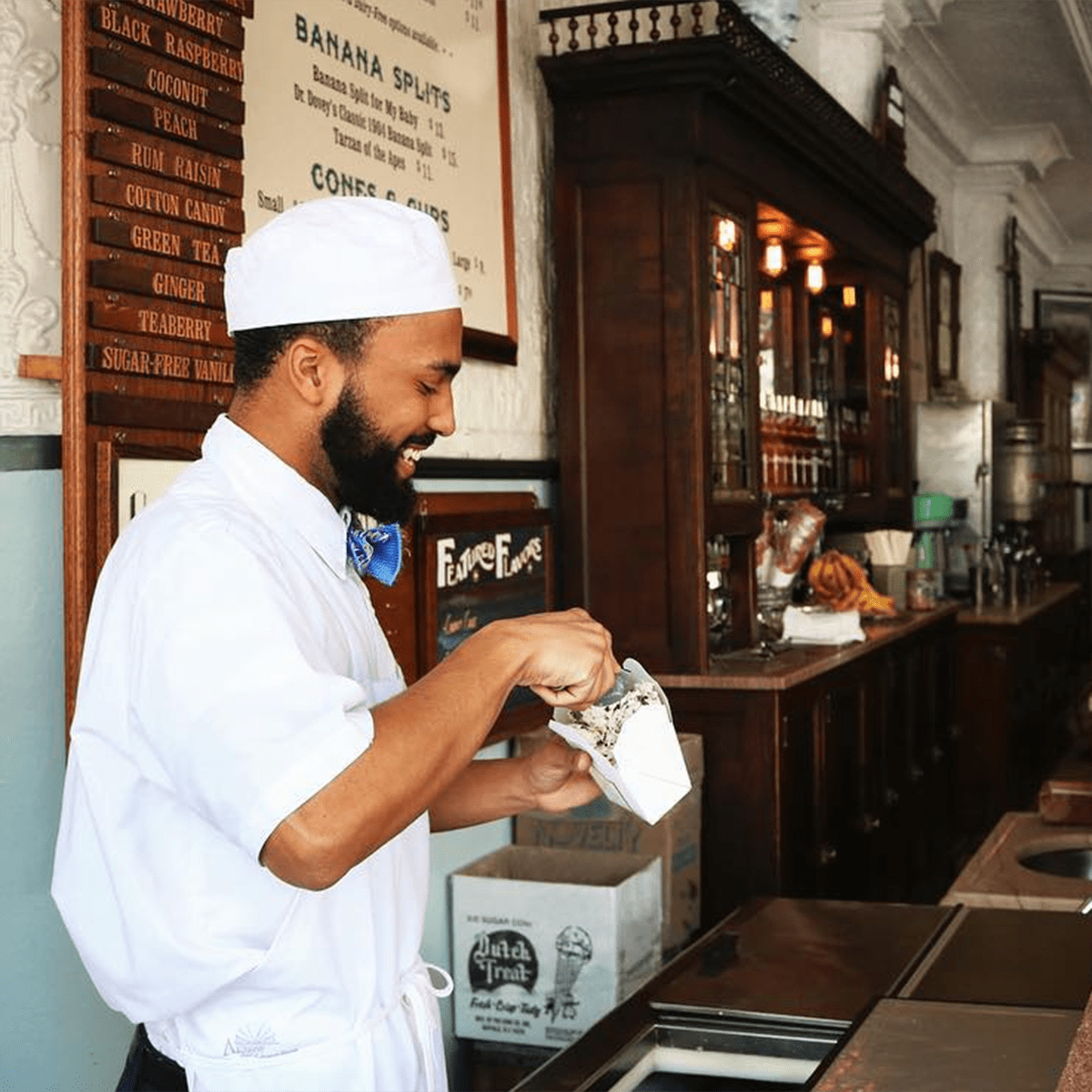 Employee filling a take-out container