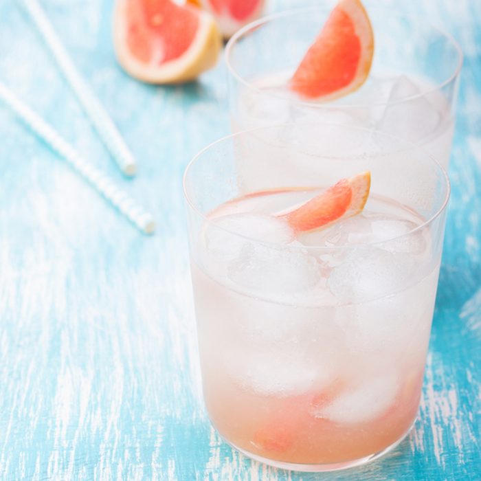 Juicy grapefruit cocktail with ice and alcohol