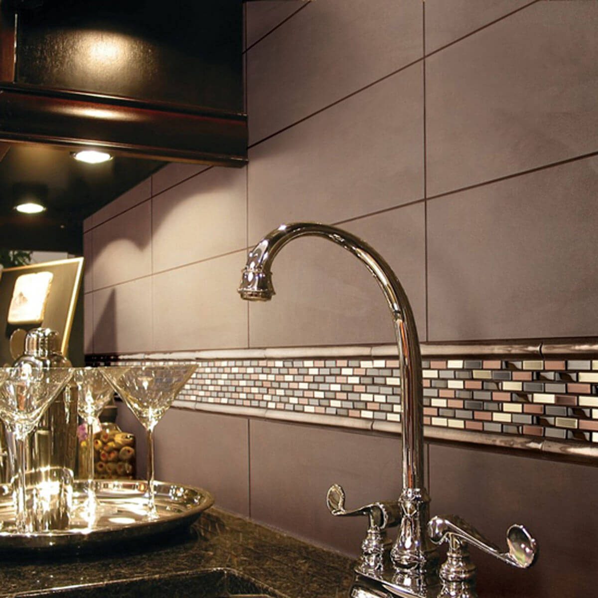 Kitchen with elegant mix and matched tile backsplash