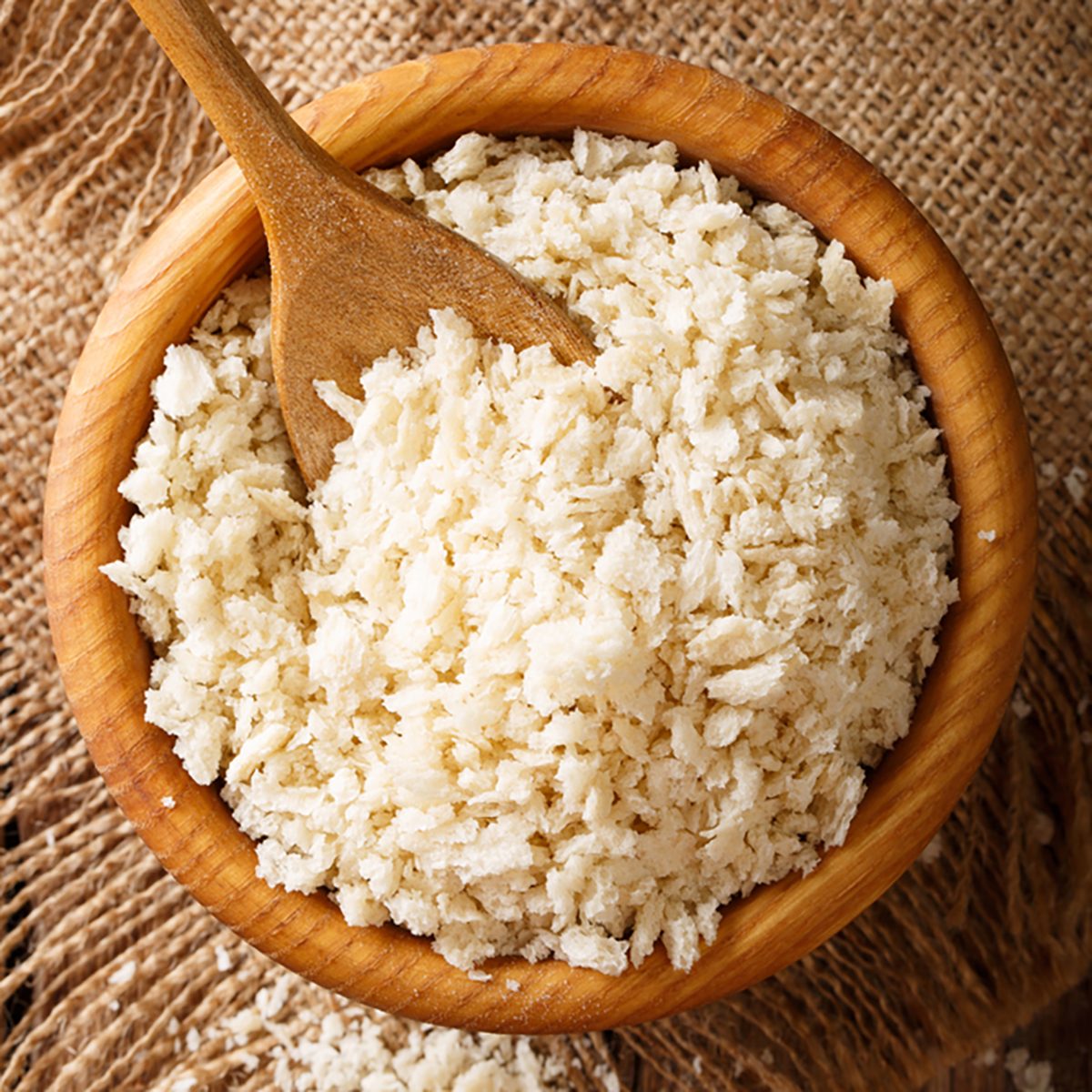 Japanese Panko crumbs for breading in a bowl on a table close-up.
