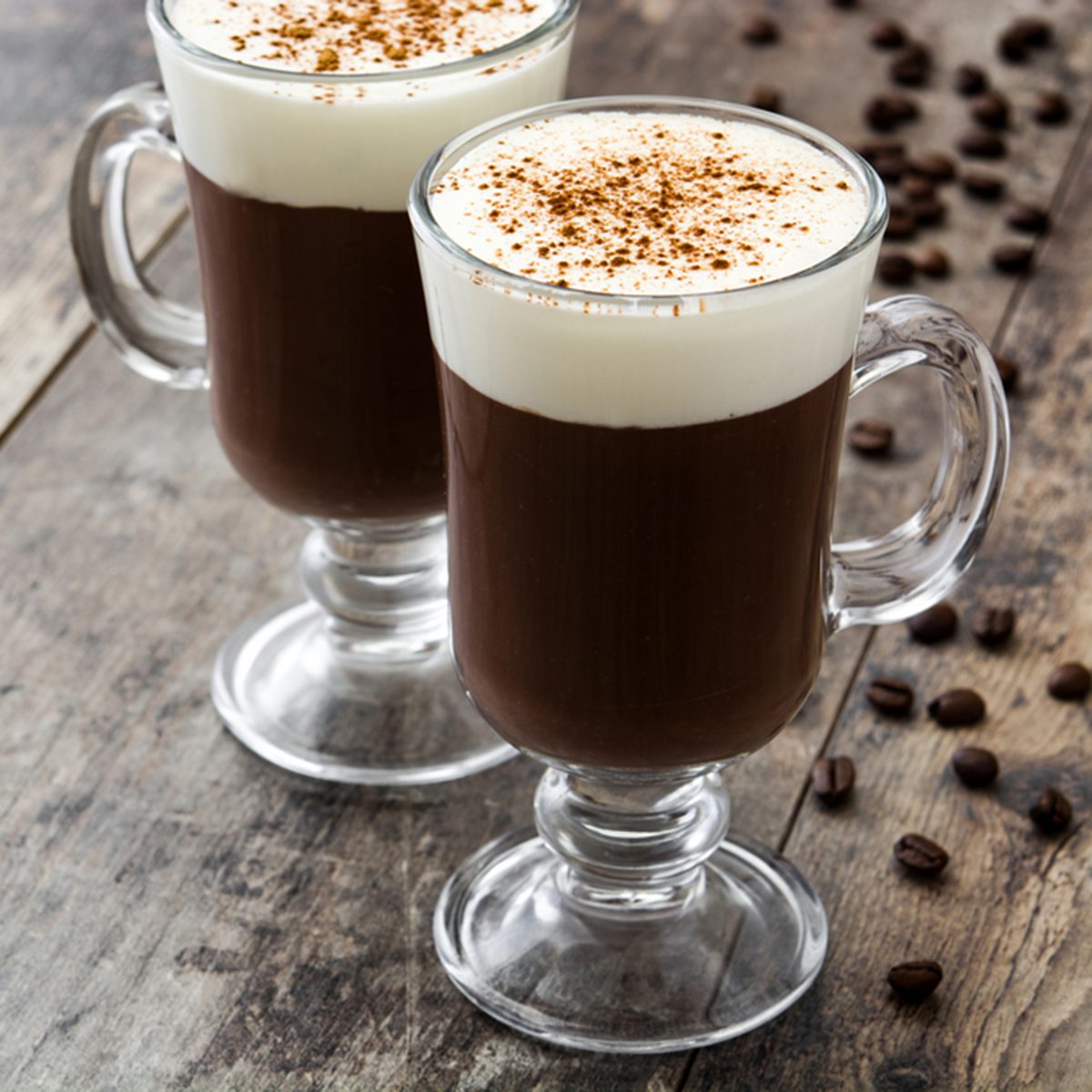 Irish coffee in glass on wooden table