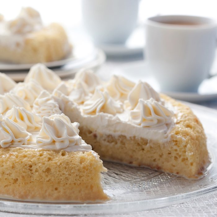 Tres leches cake served with a hot chocolate