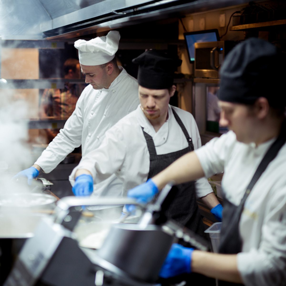 Group of chefs working in the kitchen
