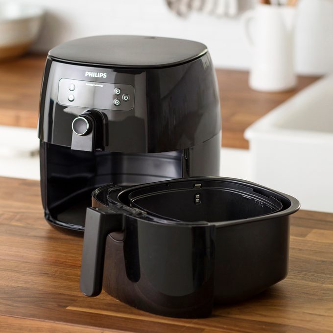 air fryer and removable basket on kitchen counter