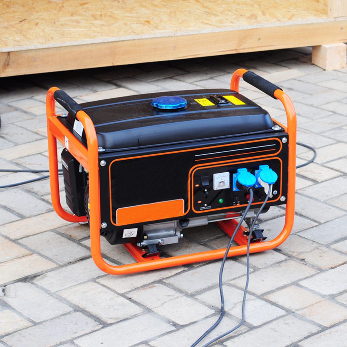 Gasoline Portable Generator on the House Construction Site.