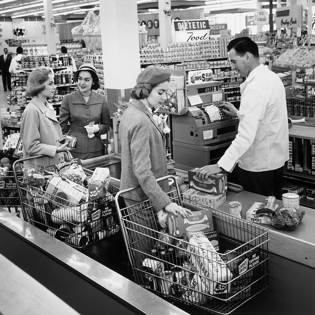 Mandatory Credit: Photo by Ewing Galloway/Uig/REX/Shutterstock (3799383a) MODEL RELEASED, Women shopping in grocery store VARIOUS