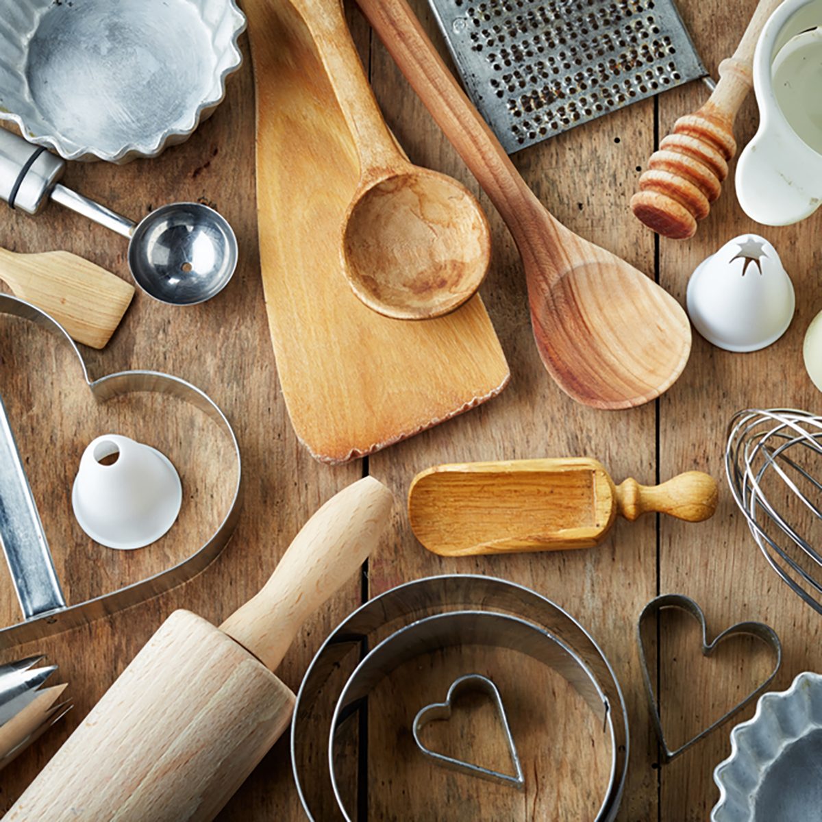 various kitchen utensils on wooden table