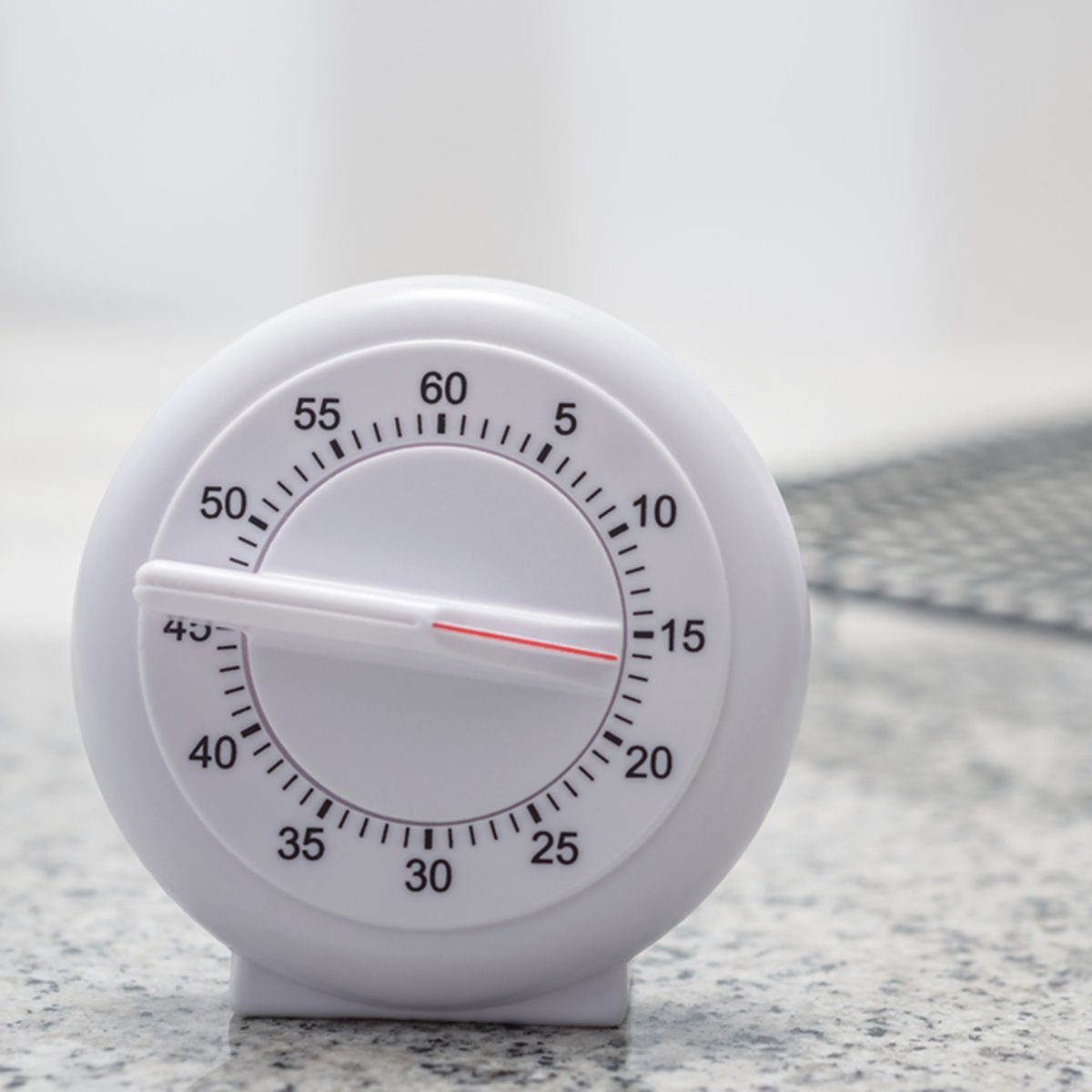Timer on kitchen worktop with cooling rack in the background