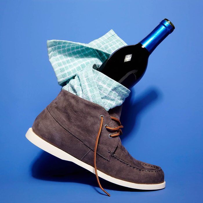 Wine bottle inside of a boot