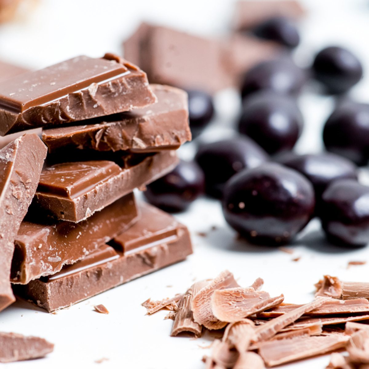 chocolate bar, shavings and cookies on a table