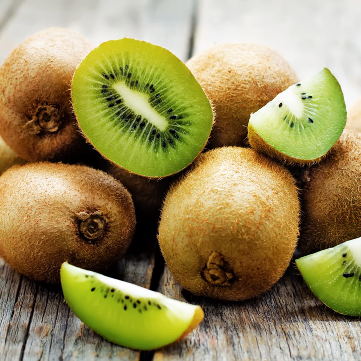 kiwi on white wood background.