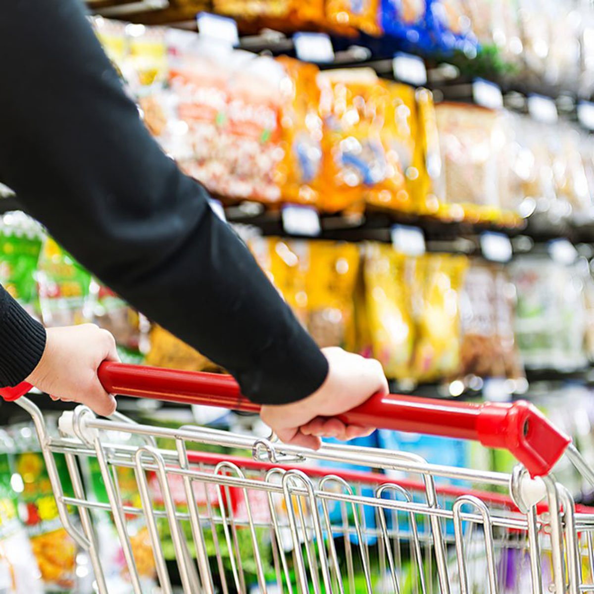 Person pushing a shopping cart