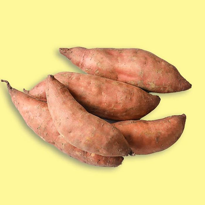 Sweet potatoes on light background