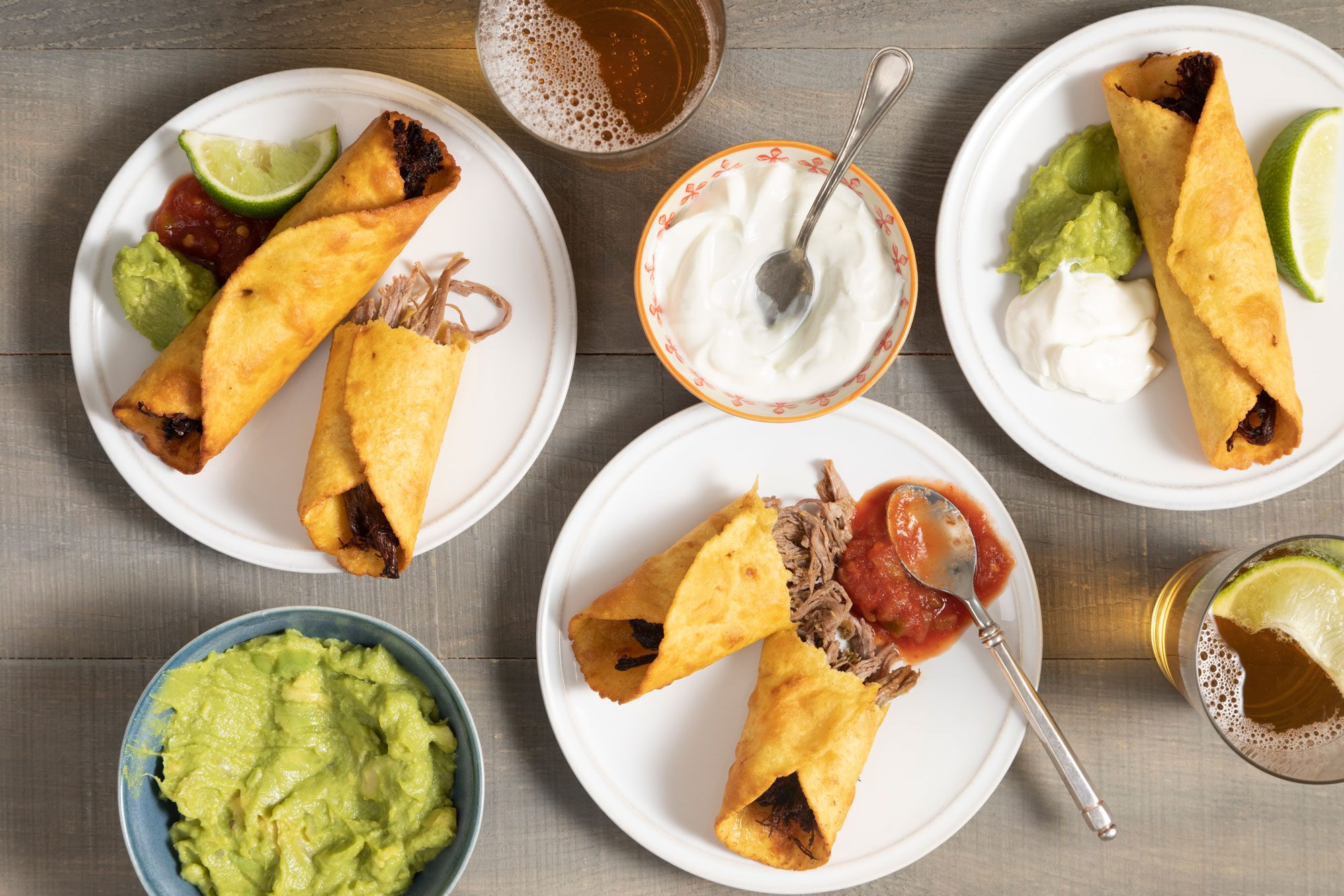 Beef Flautas served with guacamole, sauce and beer