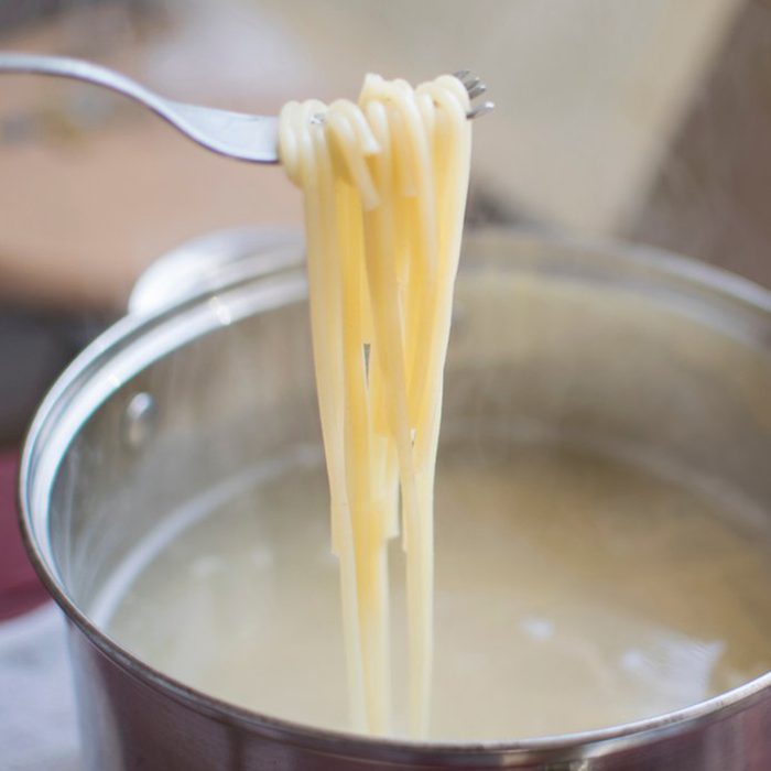 Cooked pasta on fork
