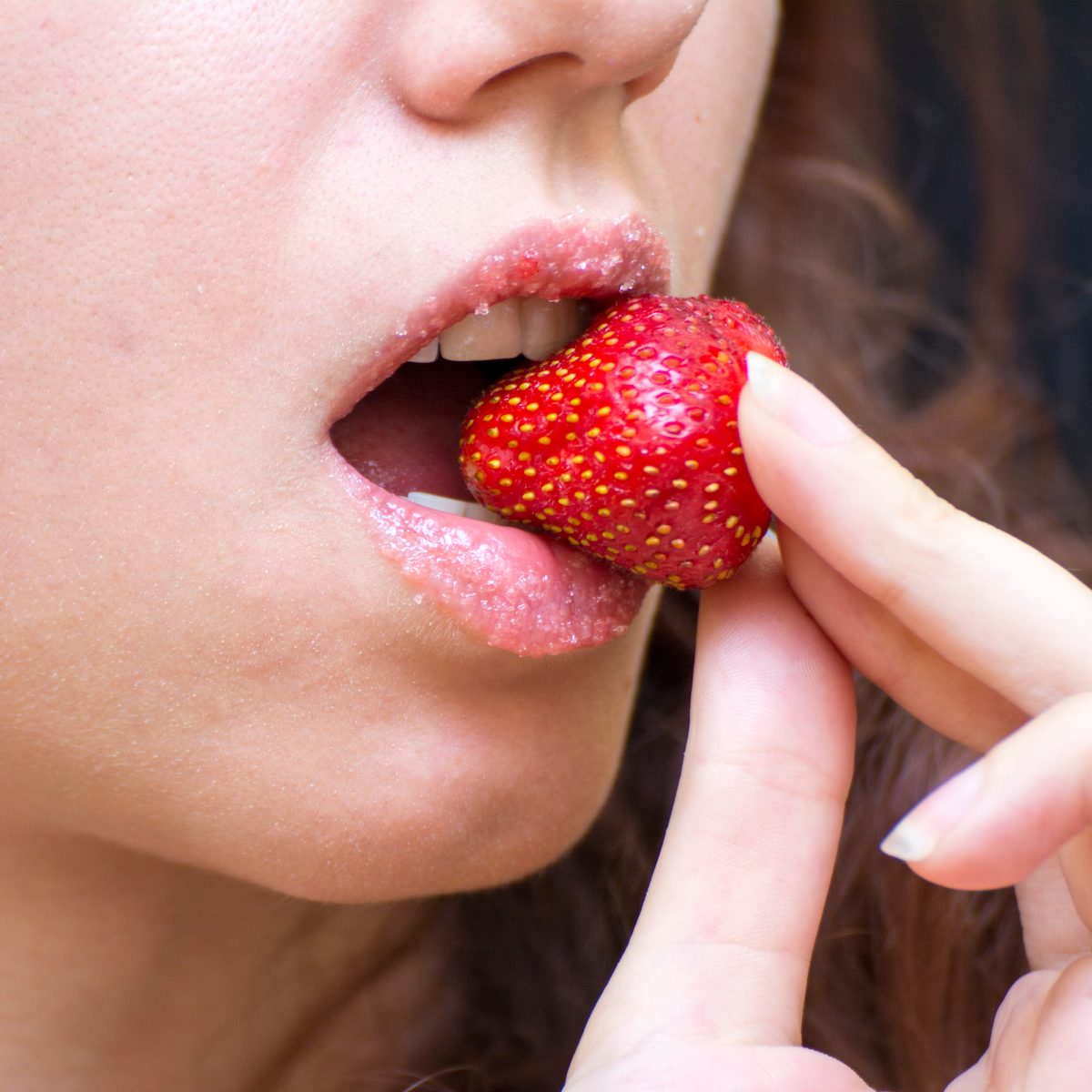 Strawberry lip scrub made at home to exfoliate lips