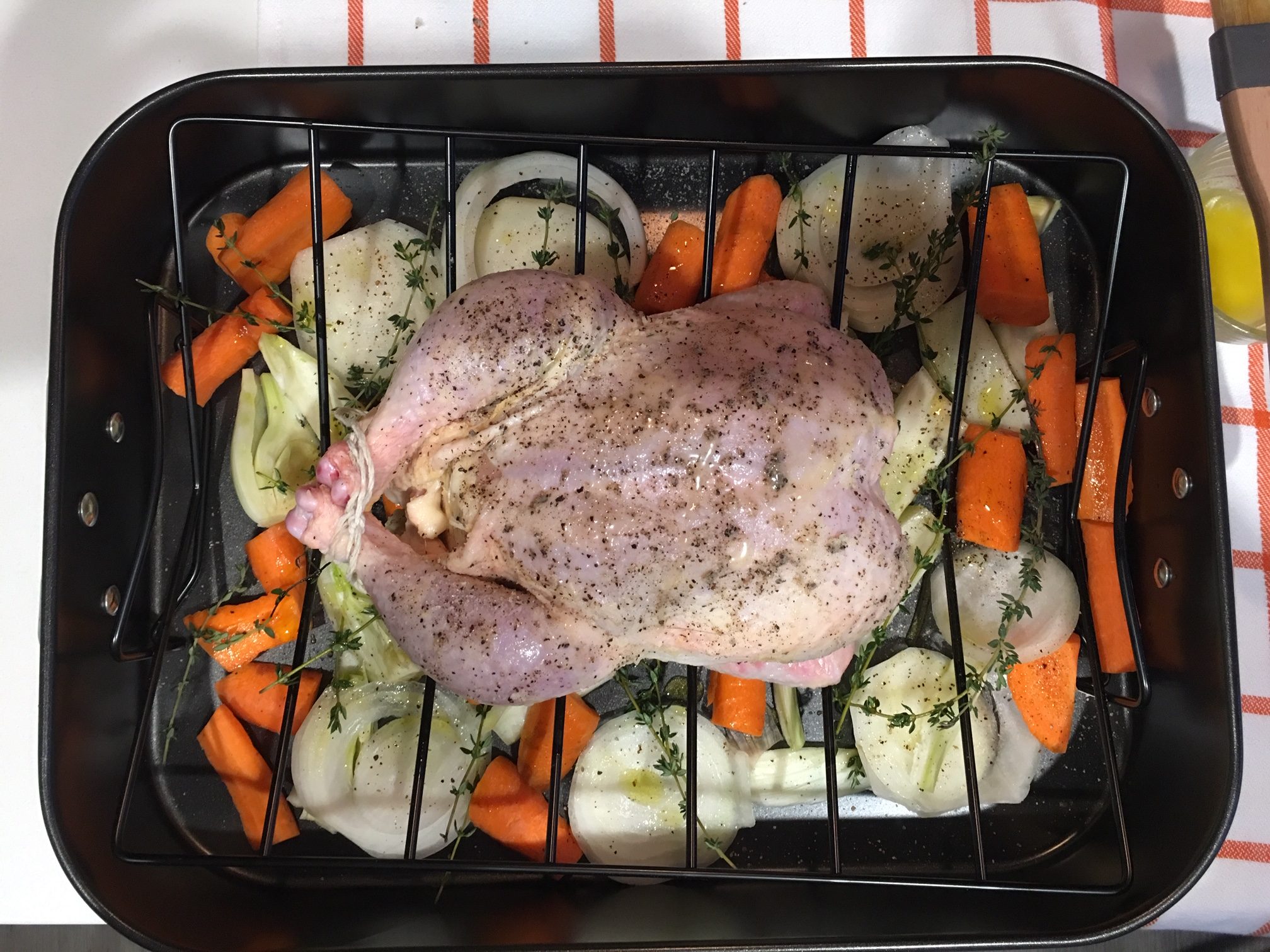 ina garten roast chicken on roasting dish before baking