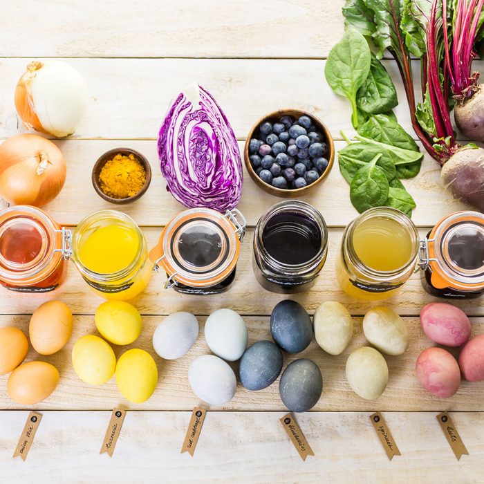 Several vegetables, Jars, and eggs placed on a table