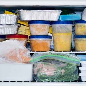 a freezer packed with chicken, soup and various frozen food; Shutterstock ID 791543500; Job (TFH, TOH, RD, BNB, CWM, CM): TOH Freezing Soup