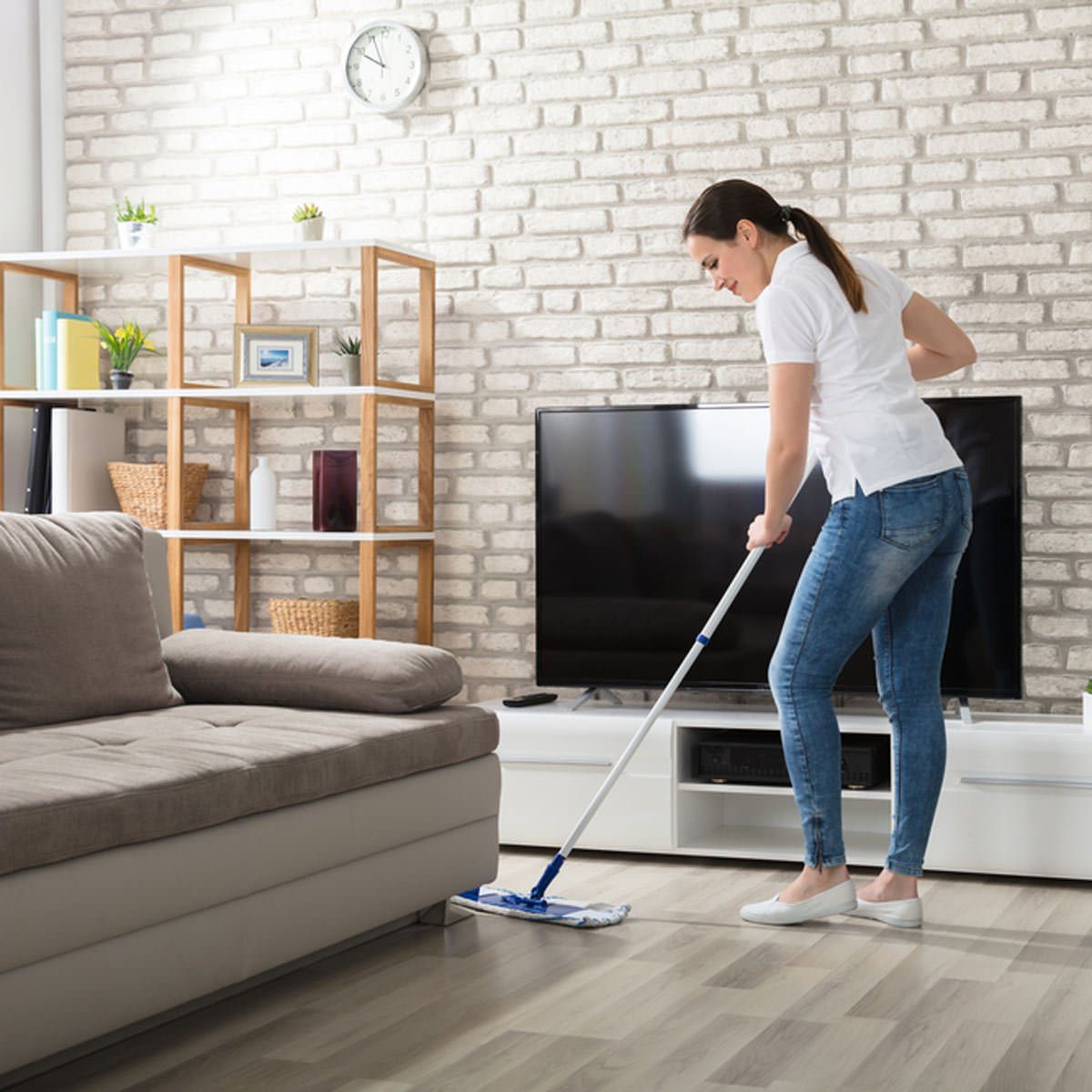 Woman cleaning hard wood floors