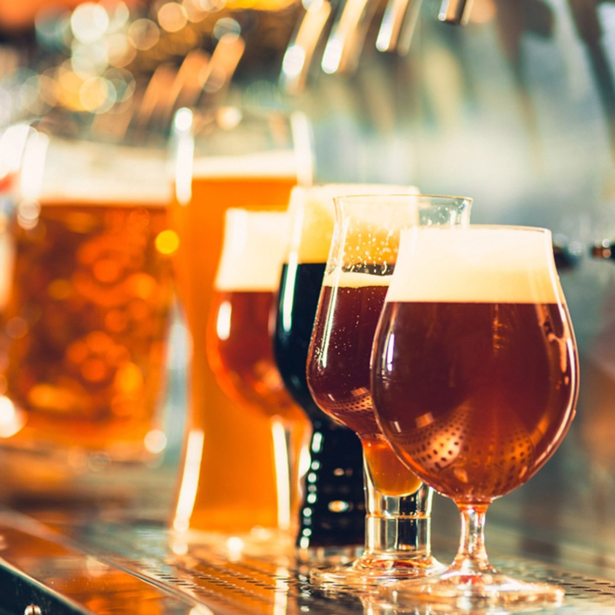 The beer taps in a pub. nobody. Selective focus.