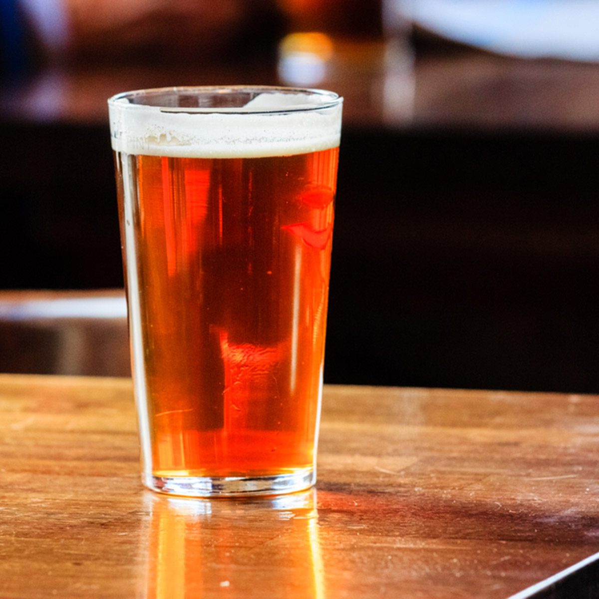 An english ale on a wooden table in a pub in London, UK