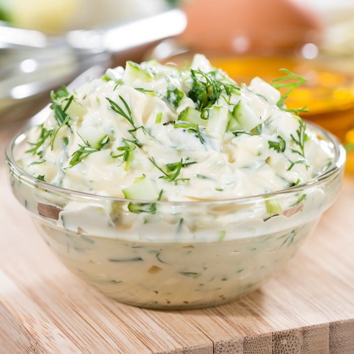 Fresh made Sauce Remoulade (close-up shot) on wooden background