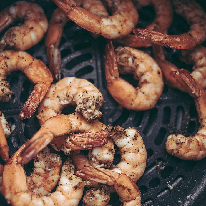 Roasted shrimps with garlic and herbs. Seafood, shelfish.