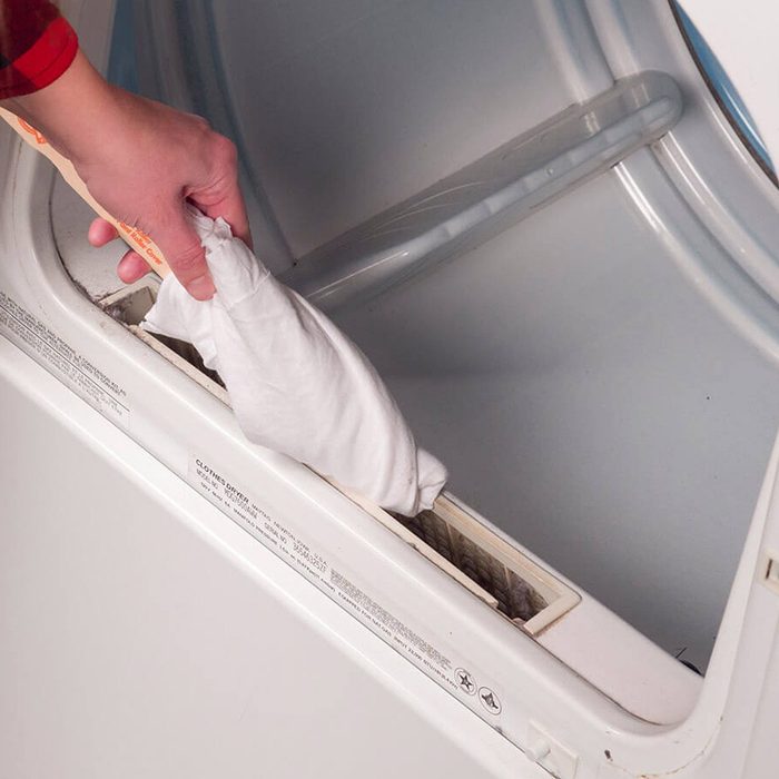 HH cleaning around lint trap on dryer