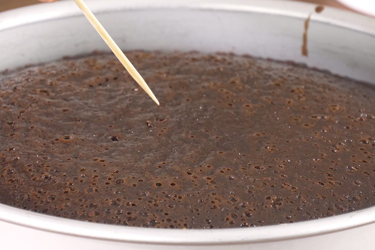 Testing a layer cake for doneness