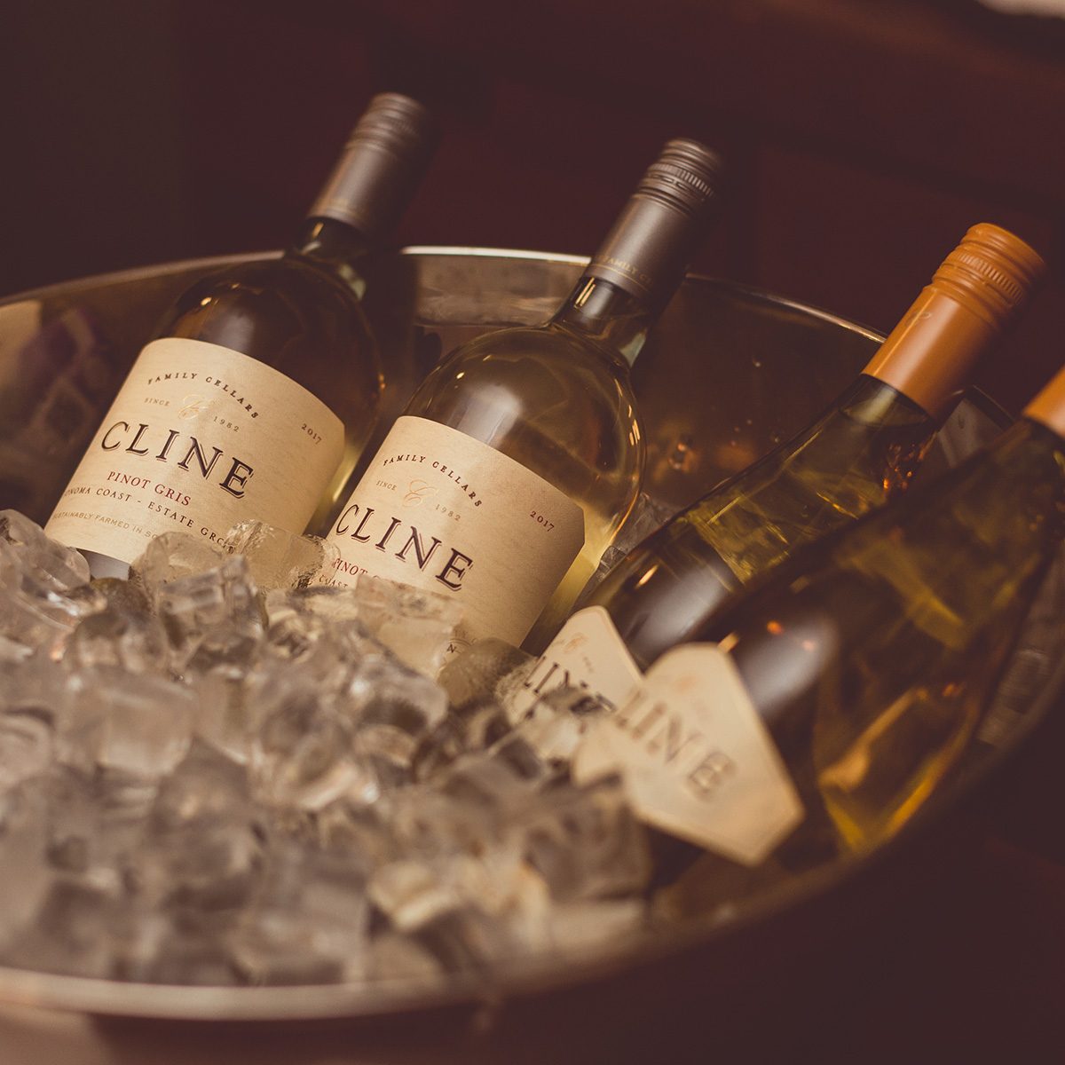 bottles of Cline Vionier and Pino Gris wine in an ice bowl. 