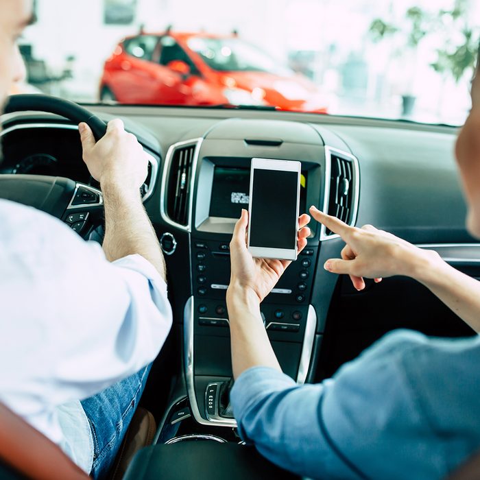 Back view of young Lover couple in car