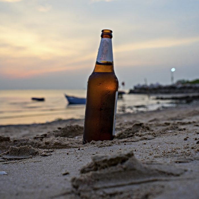 glass bottle Beer at the beach sunset