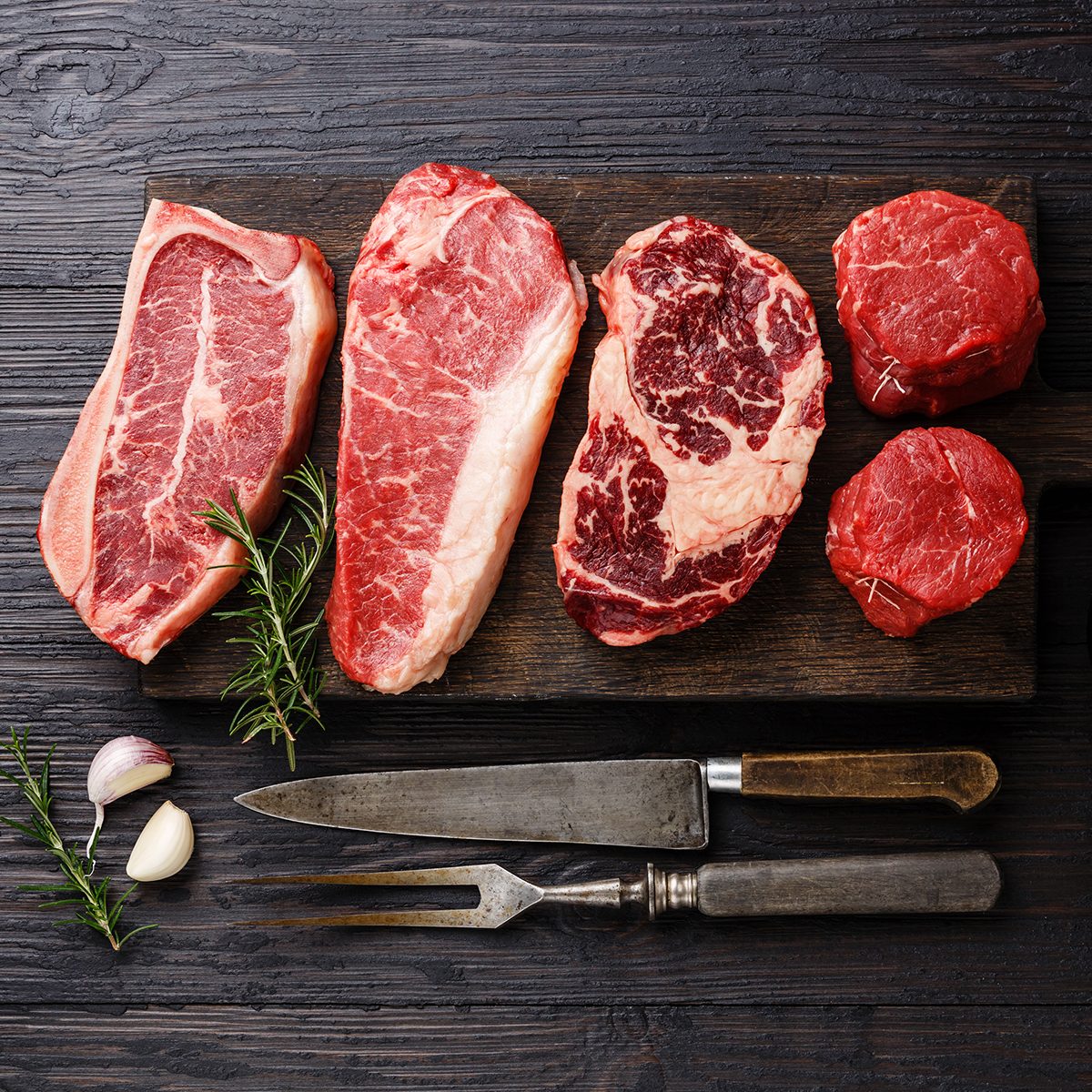 Variety of Raw Black Angus Prime meat steaks Blade on bone