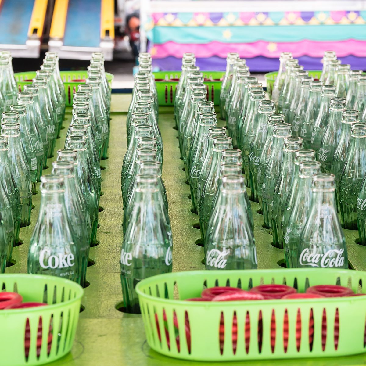 Ring toss carnival, fair game using coca cola bottles.