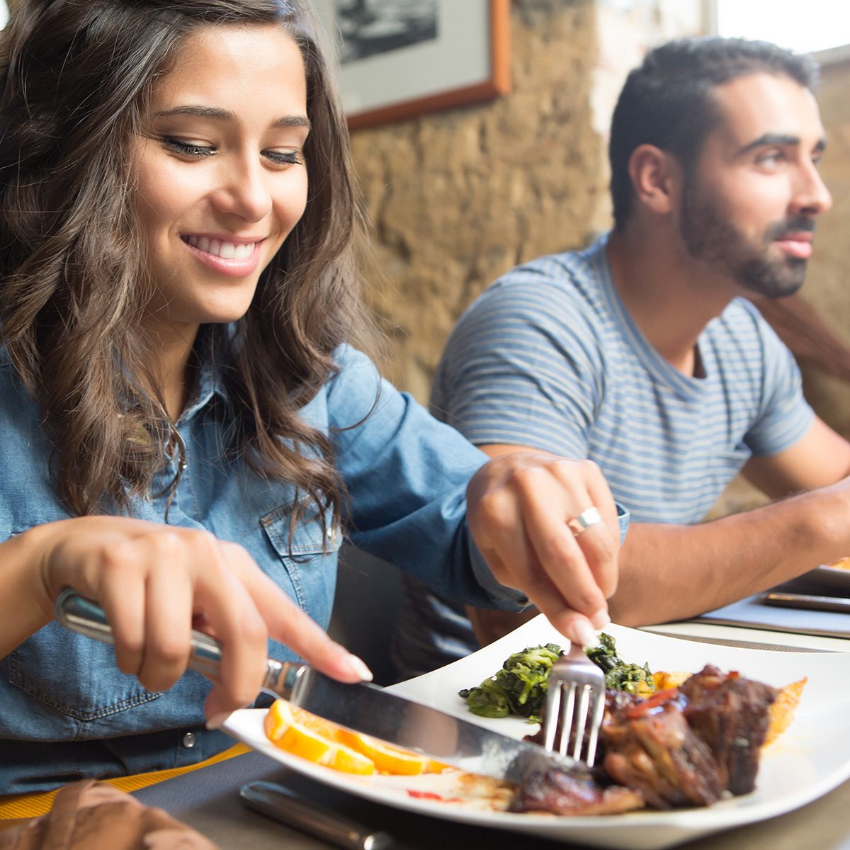 Couple having lunch at rustic gourmet restaurant