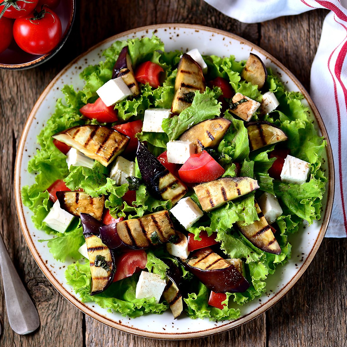 Grilled eggplant salad, tomatoes, feta and lettuce with olive oil and red balsamic, sea salt and pink pepper.